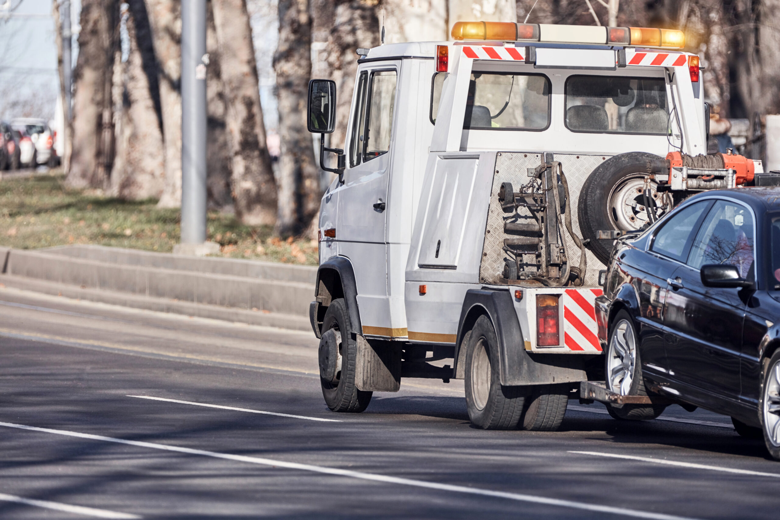 Tow truck repossessing a vehicle – stop repossession with Virginia bankruptcy attorney