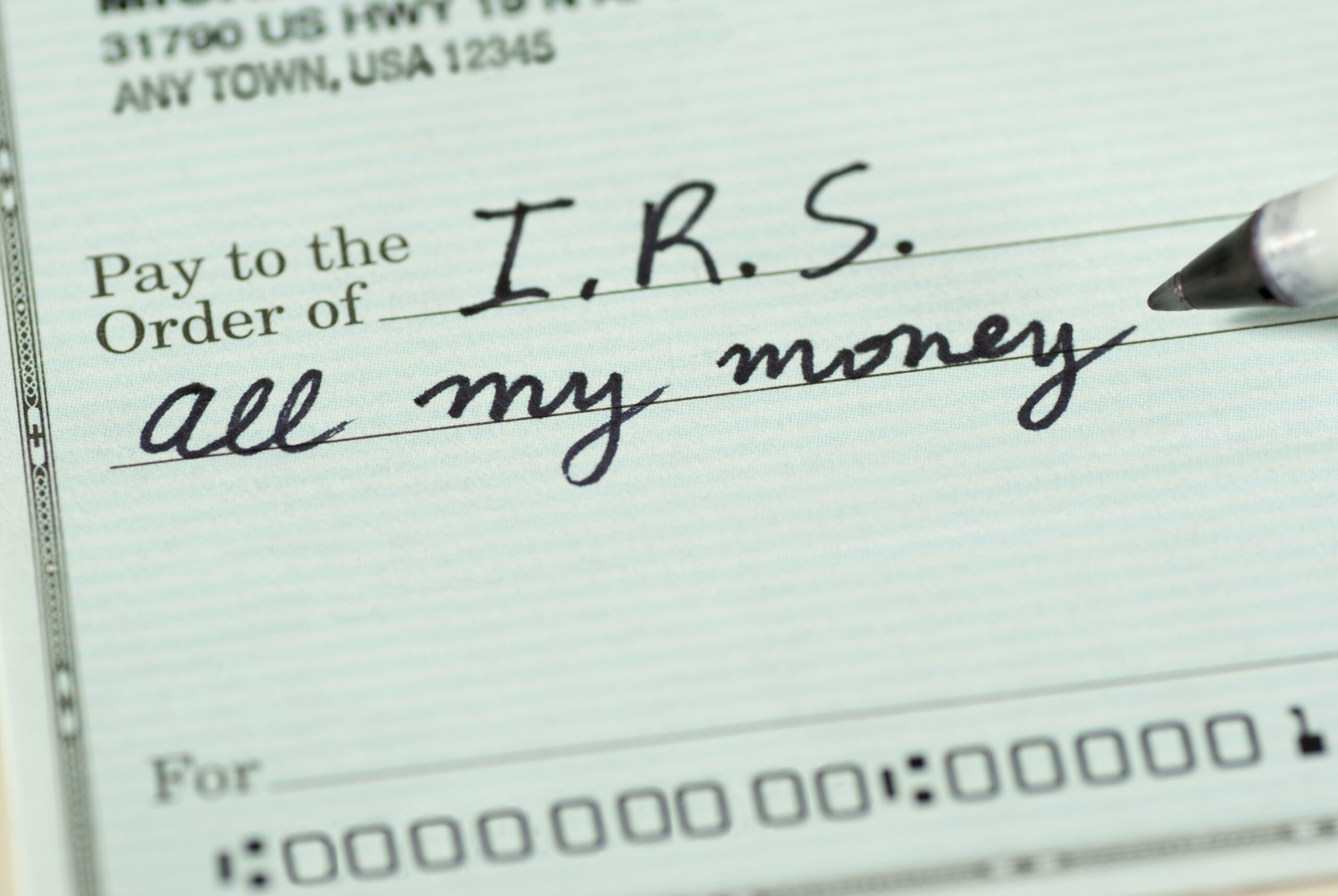 Handwritten check made out to the I.R.S. for "all my money" — can you file bankruptcy on IRS tax debt, Merna Law Virginia